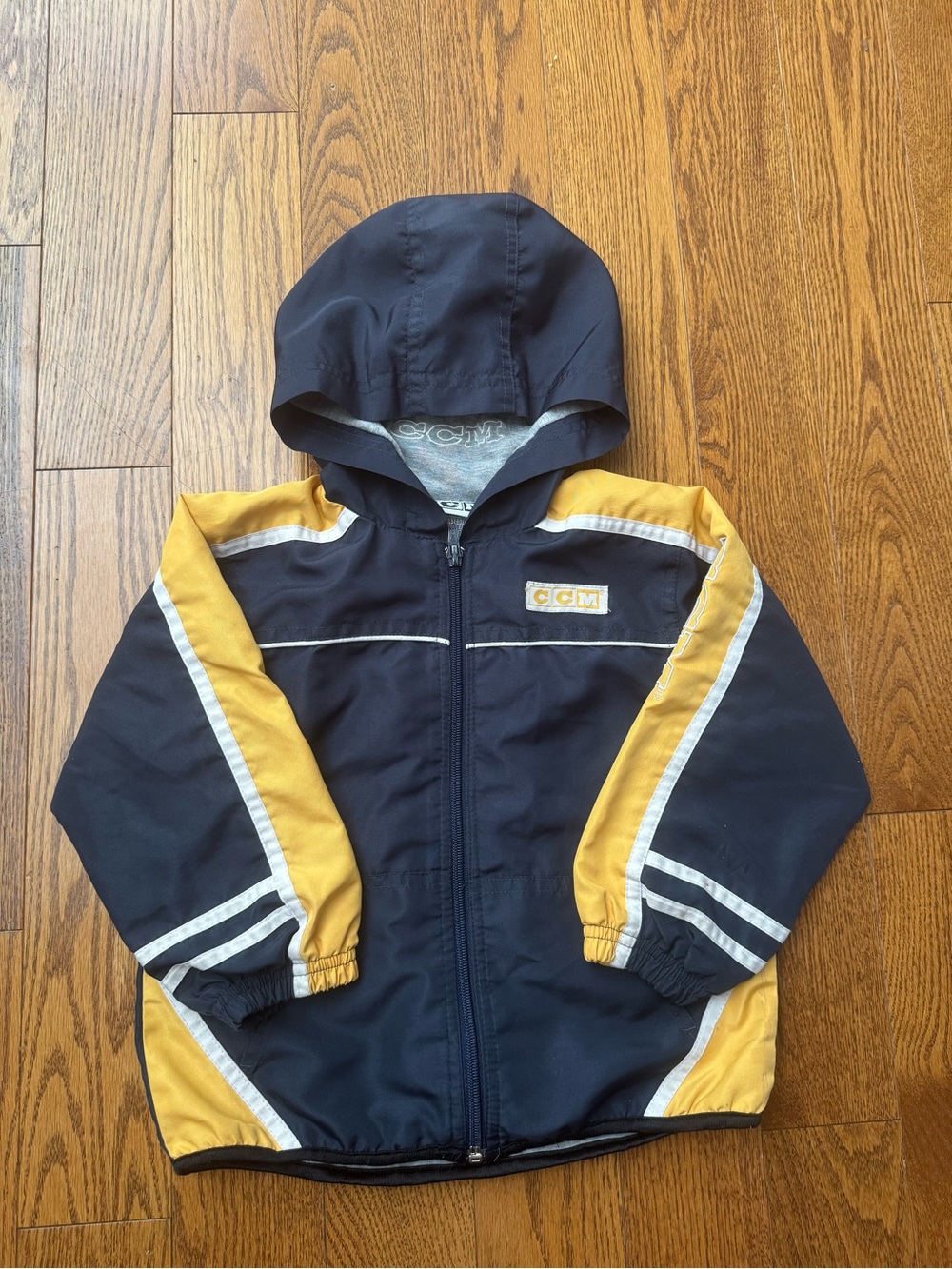 Early 2000s CCM Navy and Yellow Hooded Kids Jacket